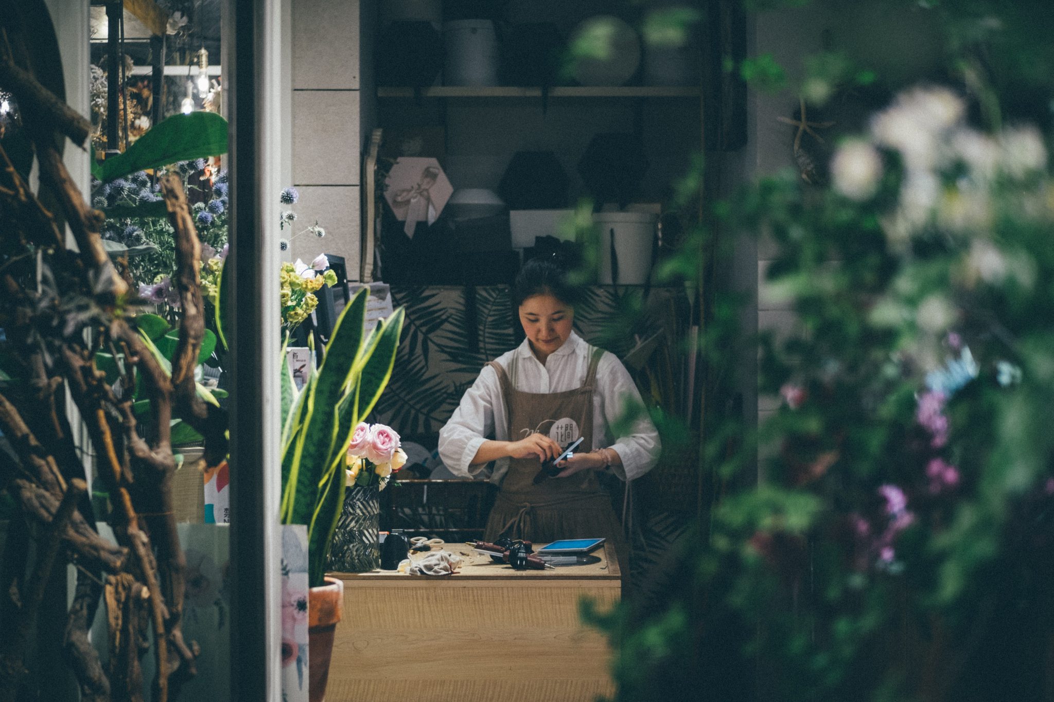 local florist working in flower shop